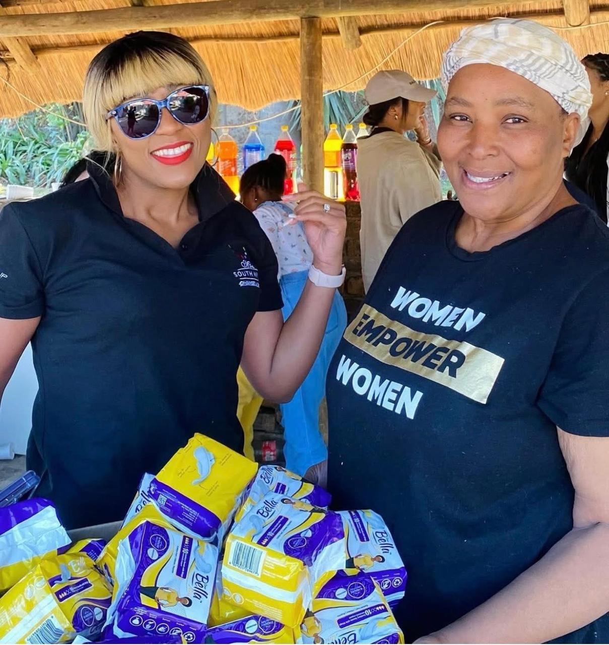 Buli on outreach with a Women Empower Women volunteer