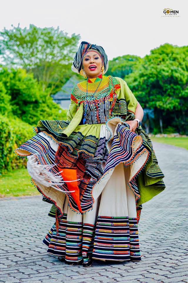 Buli in green Xhosa gown with beaded turban