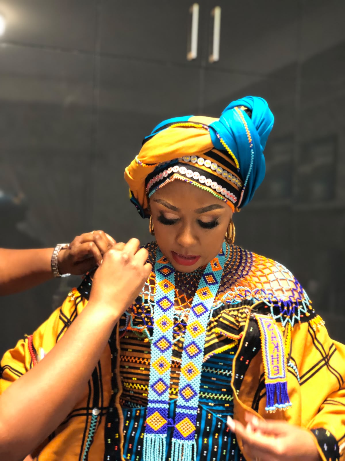 Buli in yellow and blue beaded ensemble