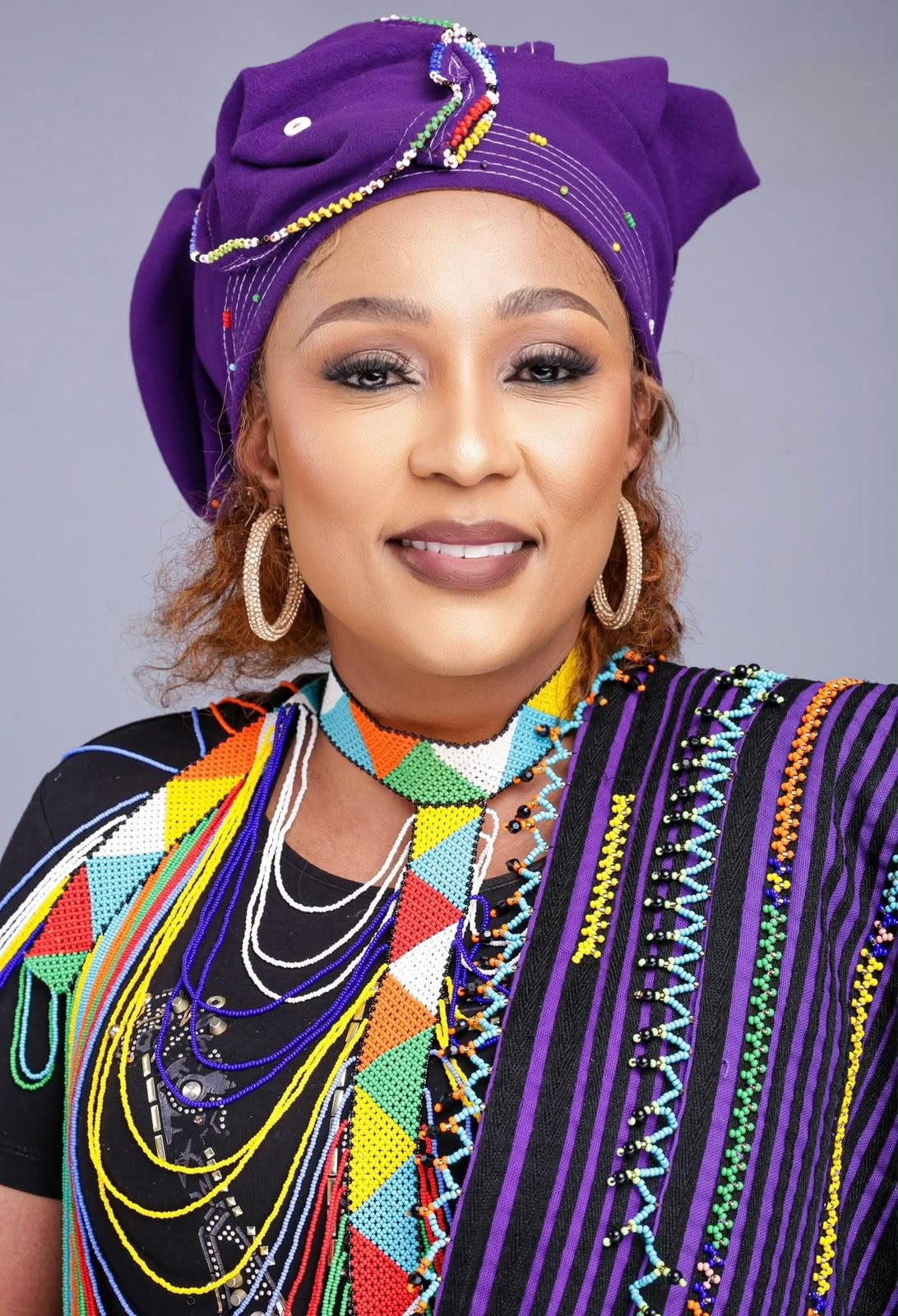 Portrait of Buli in purple turban with beadwork